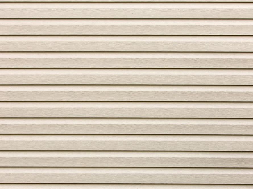 Detailed shot of vinyl plastic siding boards showing grain and alignment
